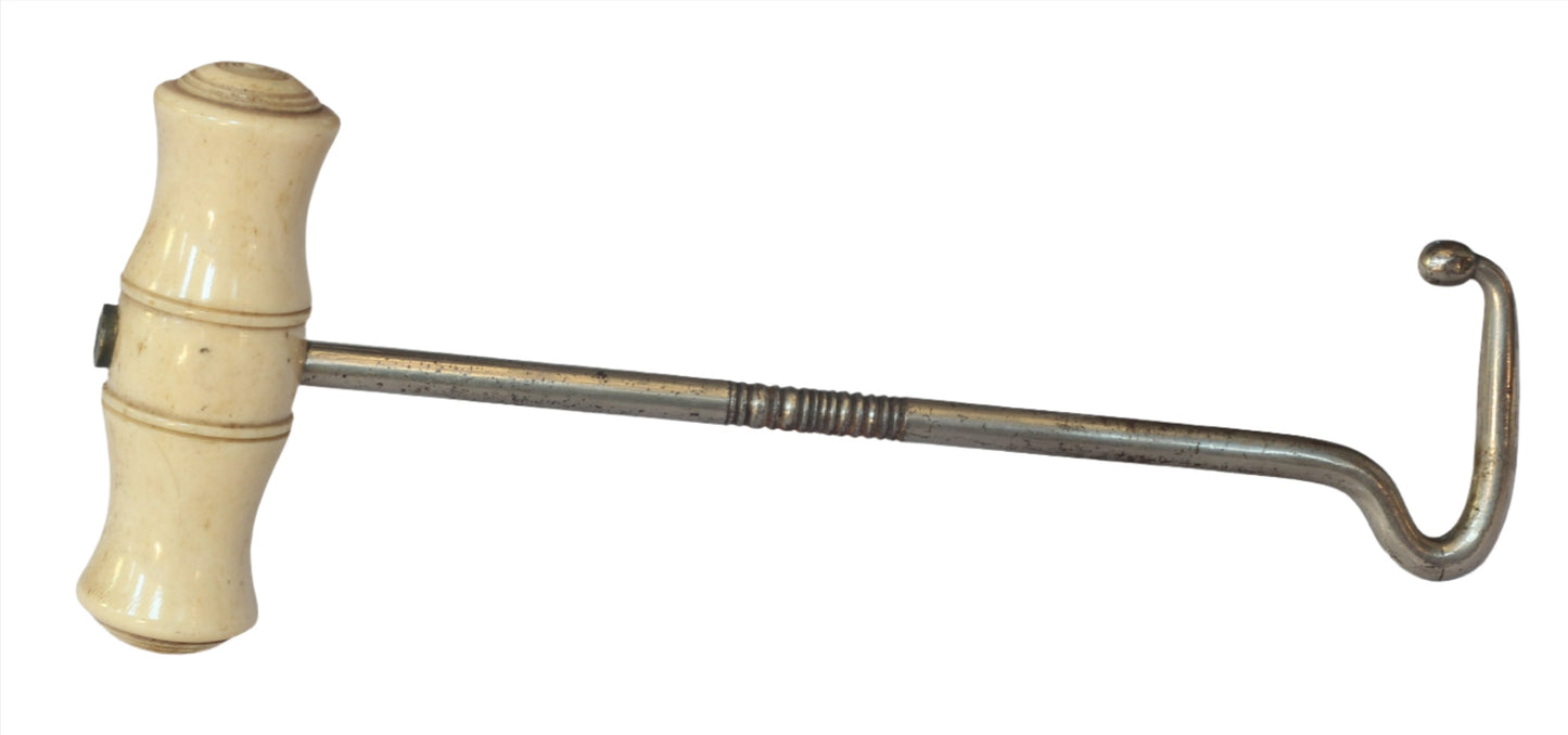 Antique bone handled boot hooks