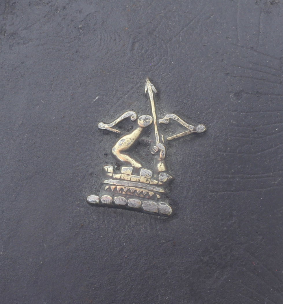 Crest on antique leather blinker