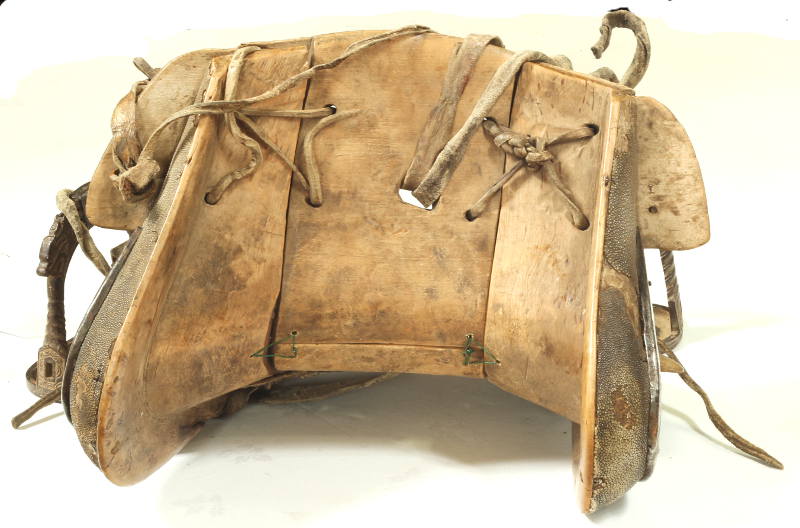 An 18th / 19th Century Chinese saddle and stirrups