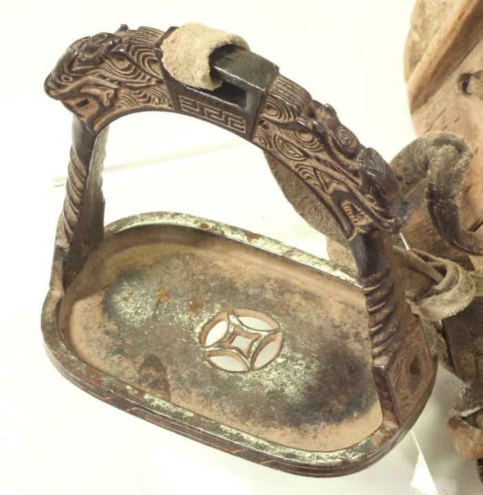 An 18th / 19th Century Chinese saddle and stirrups