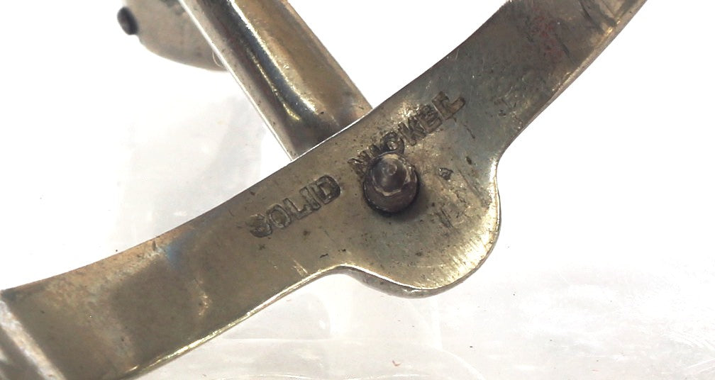Pair of Nickel Swan Necked Mess Fixed Spurs