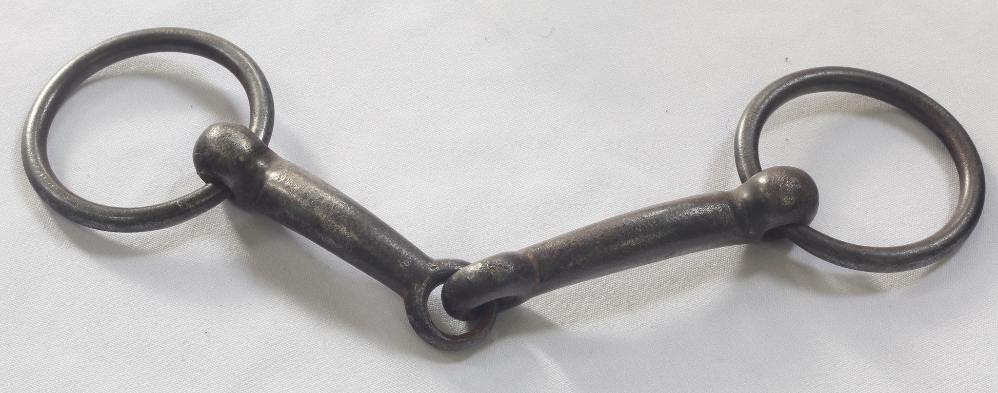 An Antique Steel Loose Ring Snaffle Bit