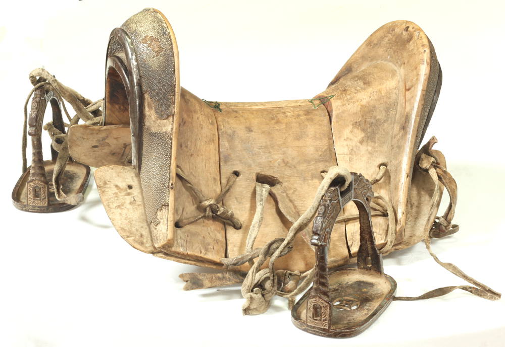 An 18th / 19th Century Chinese saddle and stirrups