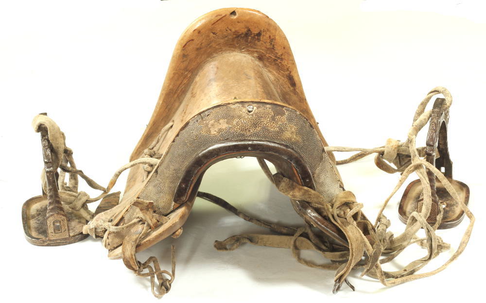 An 18th / 19th Century Chinese saddle and stirrups