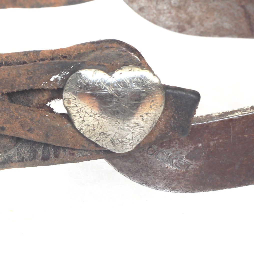 A Pair of Crockett Cowboy Spurs with Heart Buttons