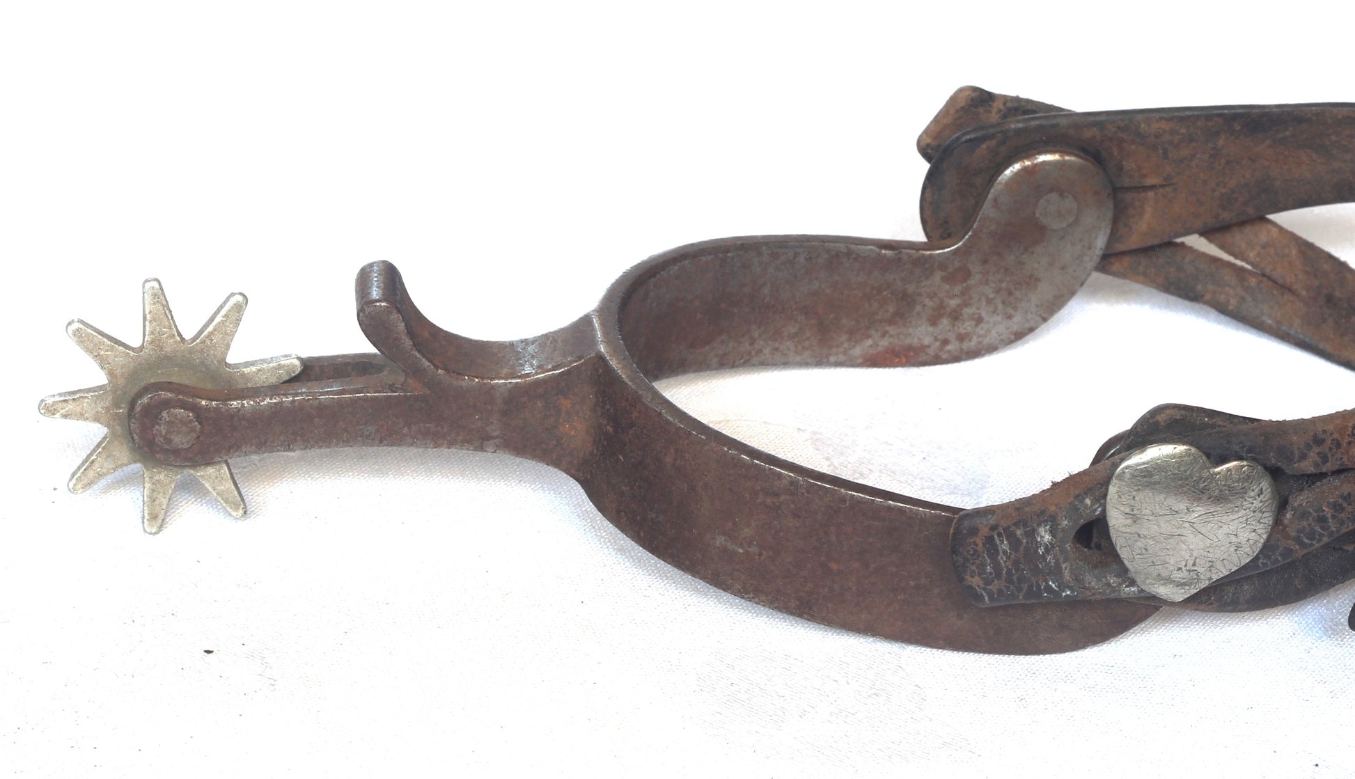 A Pair of Crockett Cowboy Spurs with Heart Buttons